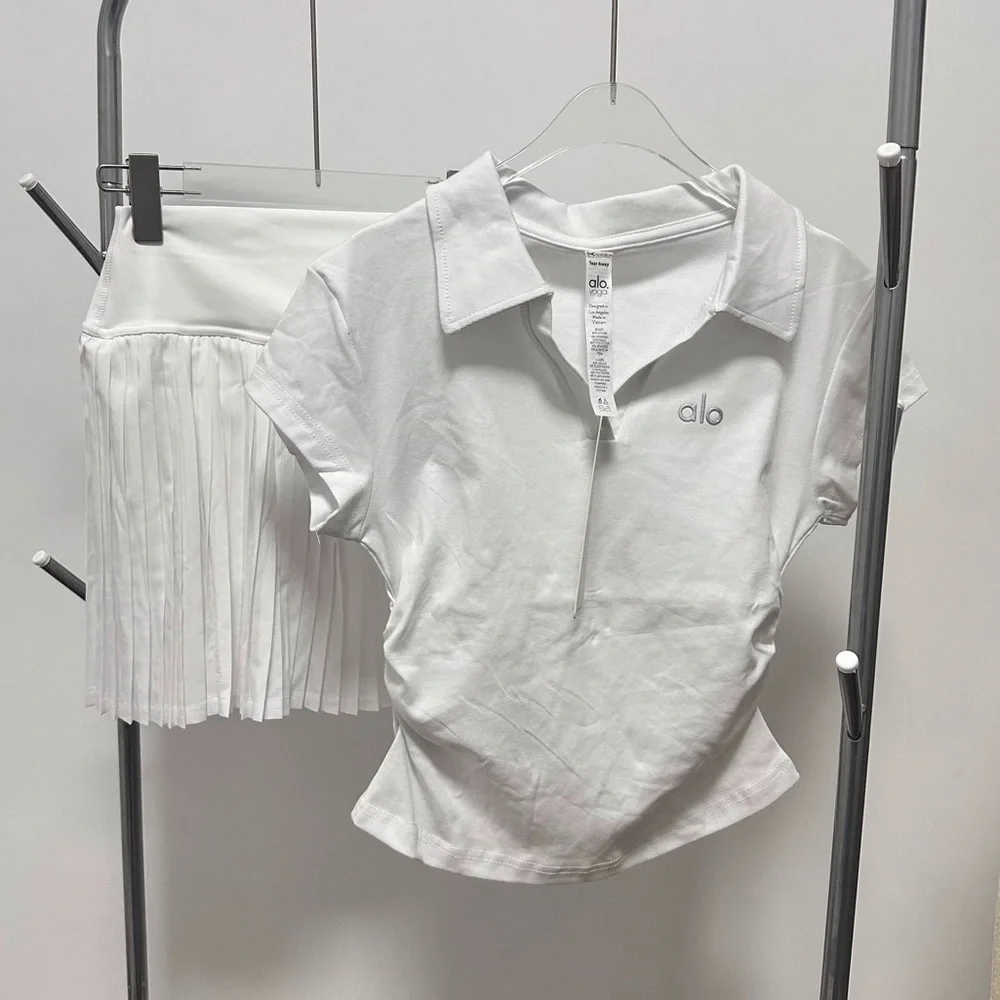 ALO Yoga Women's White Tennis Short Sleeved Top With Pleated Skirt Set